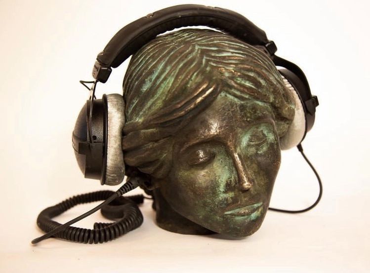 Statue wearing headphones